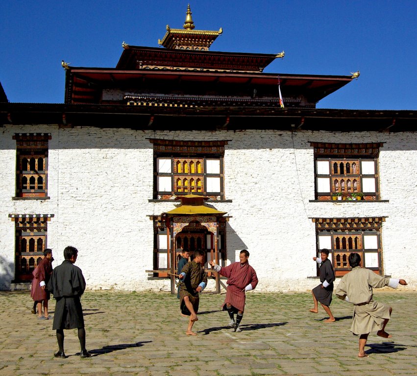 Lay monks practising outside Mongar Dzong, Bhutan