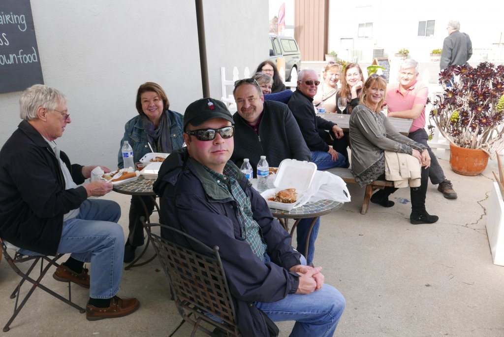 People enjoying the wonderful food truck offerings...