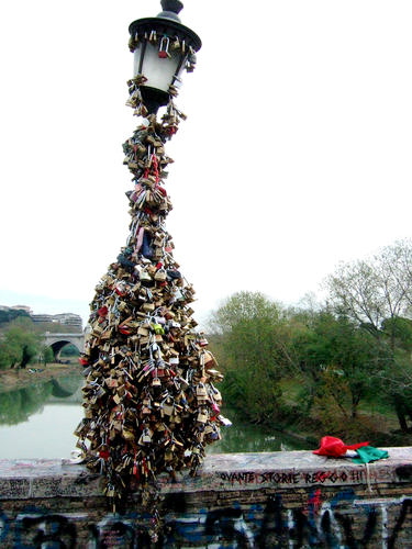 The lamp poles along Ponte Milvio in Rome can't take much more love