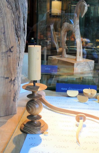 Turned and carved wooden objects in the window.