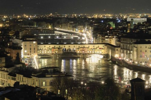 Ponte Vecchio lights up the rising river