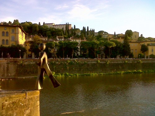 Clet's Common Man taking a step off the Alle Grazie Bridge (Photo by Francesca Boni)